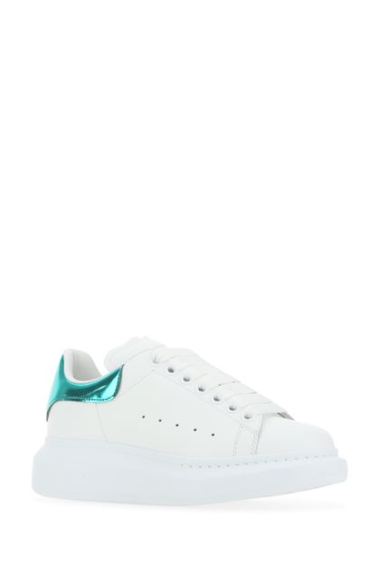 White leather sneakers with emerald green leather heel